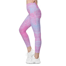 Load image into Gallery viewer, Pink and purple patterned leggings worn by a person on a white background