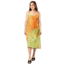 Load image into Gallery viewer, Woman wearing a colorful dress on a white background