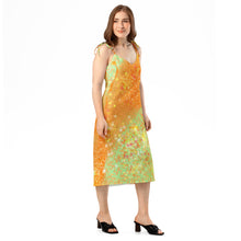 Load image into Gallery viewer, Woman wearing a colorful dress with a gradient from orange to green on a white background