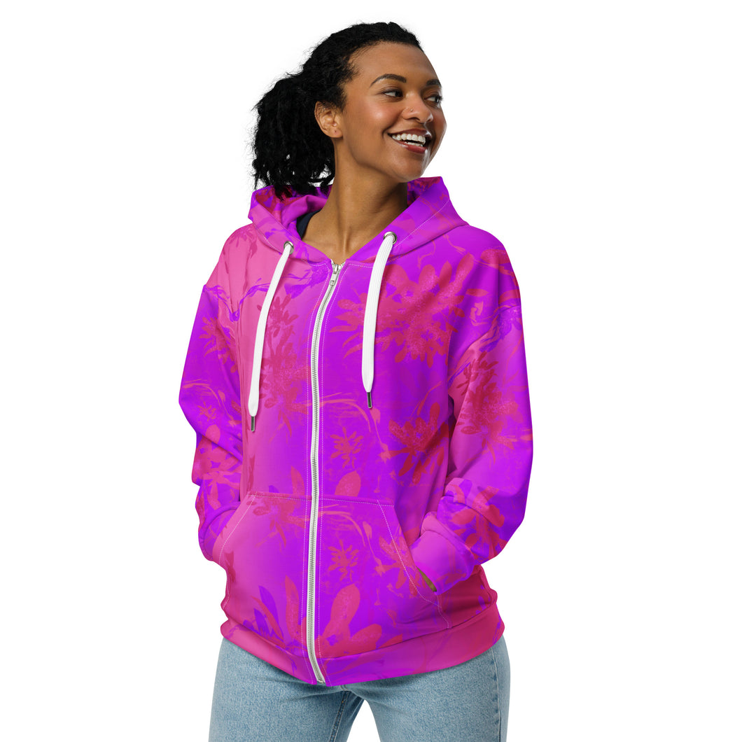 Person wearing a vibrant pink and purple hoodie with white zipper on a white background