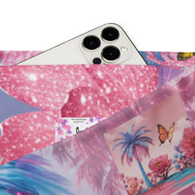 Load image into Gallery viewer, Phone inserted partial in the pockets of the leggings. The pants are  colorful design featuring palm trees and flowers on a white background
