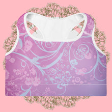 Load image into Gallery viewer, Purple and white sports bra with floral design on a pink background
