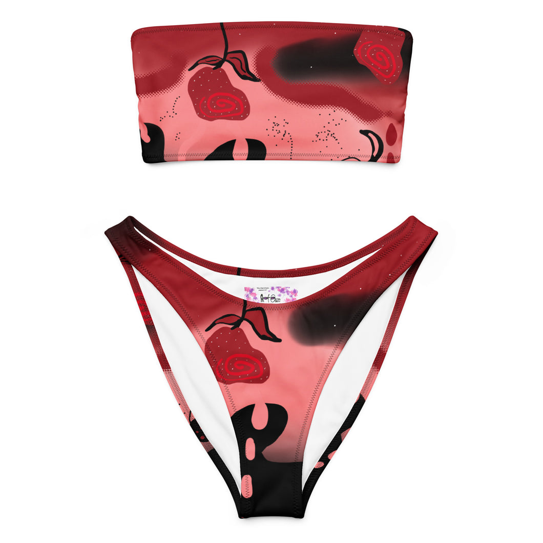 Bikini set with red and black abstract design on a white background