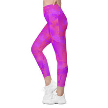 Load image into Gallery viewer, Sidewards view, of the  Verbena High Waist Leggings w/pockets Pink and purple flora leggings on a white background. 

