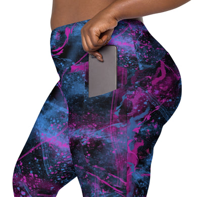 Side view of high-waisted leggings in cosmic pink and blue print, showing functional phone pocket