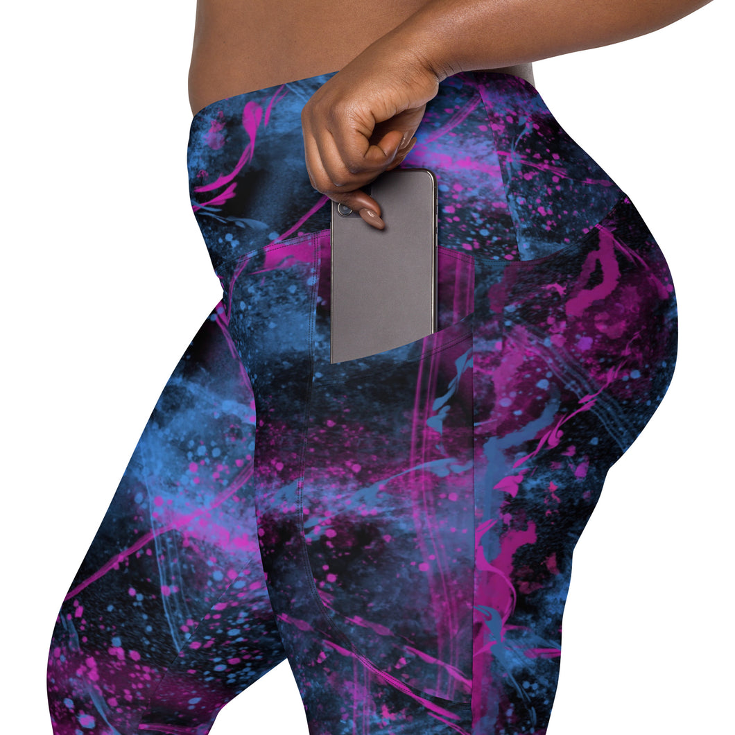 Side view of high-waisted leggings in cosmic pink and blue print, showing functional phone pocket