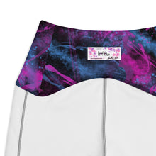 Load image into Gallery viewer, Close-up of a swimsuit with a colorful top and white bottom, featuring a brand label.
